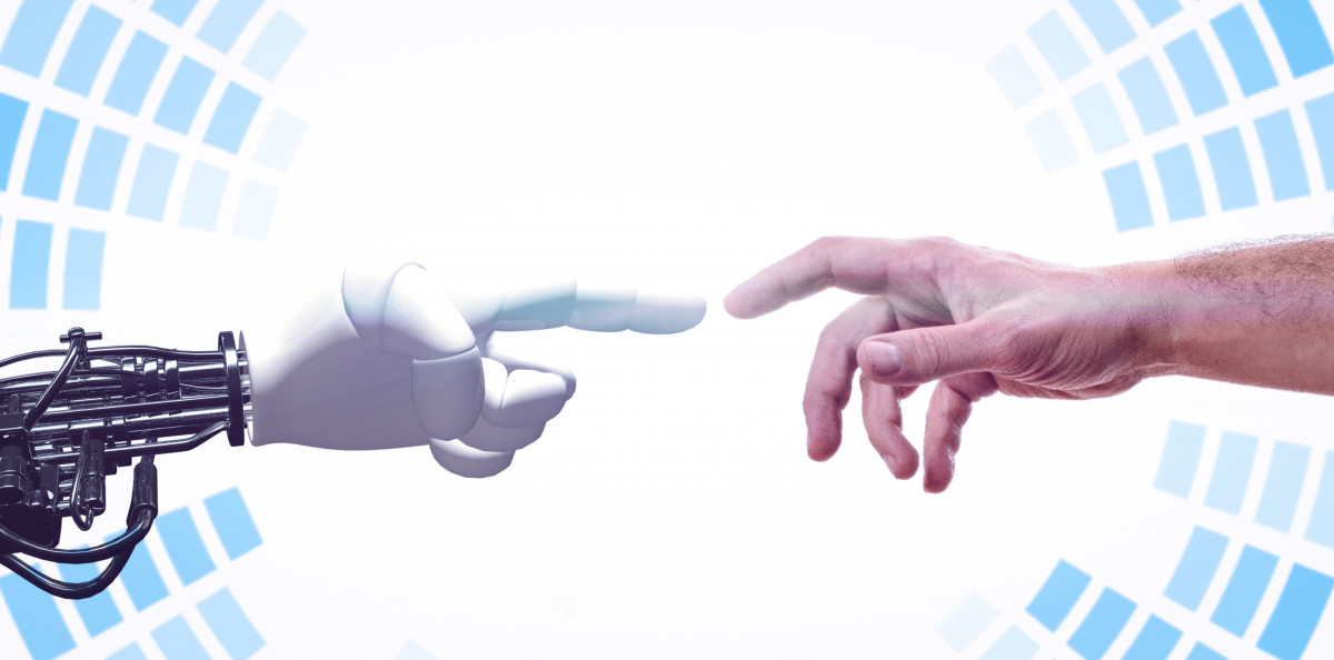 Human hand reaching toward a robot hand